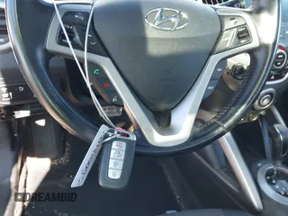 2016 Hyundai Veloster z VIN KMHTC6AD3GU267365, wystawiony jako IAAI lot #41469796 z przebiegiem 111 791 mil mil oraz . Historia ofert i sprzedaży dostępna na DreamBid. Obrazek 11.