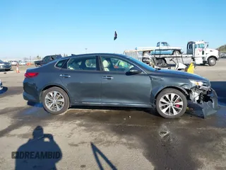 2016 Kia Optima SXL Turbo with VIN 5XXGV4L2XGG051938, listed as a IAAI auction lot 41400484 with 114,722 mi miles. Bid and sale history available at carsss.com. Image 13.