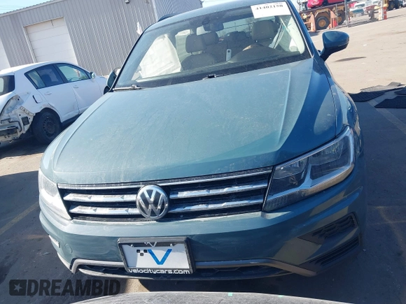 2021 Volkswagen Tiguan SE with VIN 3VV2B7AXXMM089913, listed as a IAAI auction lot 41402158 with 68,158 mi miles and . Bid and sale history available at DreamBid. Image 12.