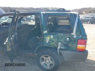 1997 Jeep Grand Cherokee Laredo with VIN 1J4GZ58S2VC595442, listed as a IAAI auction lot 41772133 with 229,764 mi miles. Bid and sale history available at carsss.com. Image 6.