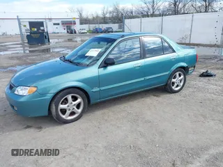 2002 Mazda Protege DX z VIN JM1BJ225721591435, wystawiony jako IAAI lot #42117544 z przebiegiem 191 185 mil mil oraz . Historia ofert i sprzedaży dostępna na DreamBid. Obrazek 2.