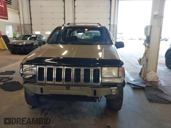 1996 Jeep Grand Cherokee Laredo with VIN 1J4GZ58S9TC293787, listed as a IAAI auction lot 41179368 with 141,755 mi miles. Bid and sale history available at carsss.com. Image 13.