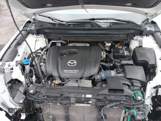 2019 Mazda CX-5 Sport with VIN JM3KFBBM2K0629966, listed as a IAAI auction lot 41953702 with 48,496 mi miles and . Bid and sale history available at DreamBid. Image 10.