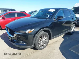 2021 Mazda CX-5 Grand Touring with VIN JM3KFADM1M0406098, listed as a IAAI auction lot 41654735 with 33,050 mi miles. Bid and sale history available at carsss.com. Image 2.