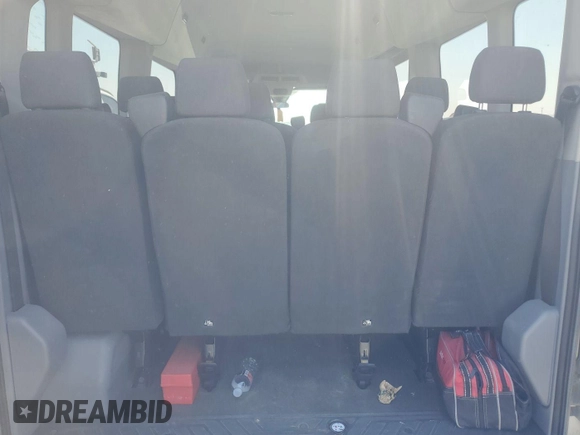2017 Ford Transit Passenger XL z VIN 1FBAX2CG2HKB34677, wystawiony jako IAAI lot #42376375 z przebiegiem 175 413 mil mil oraz . Historia ofert i sprzedaży dostępna na DreamBid. Obrazek 4.