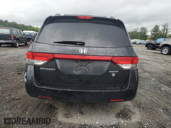 2014 Honda Odyssey Touring with VIN 5FNRL5H95EB056118, listed as a Copart auction lot 57729865 with Not provided miles and Salvage title. Bid and sale history available at DreamBid. Image 6.