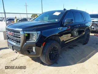 2021 GMC Yukon AT4 with VIN 1GKS2CKD2MR169740, listed as a IAAI auction lot 41472470 with 103,662 mi miles. Bid and sale history available at carsss.com. Image 2.