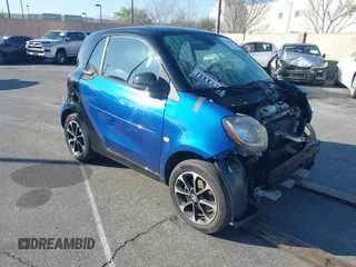 2016 Smart fortwo Passion z VIN WMEFJ5DA4GK067126, wystawiony jako IAAI lot #41559385 z przebiegiem 79 540 mil mil oraz . Historia ofert i sprzedaży dostępna na DreamBid. Obrazek 1.