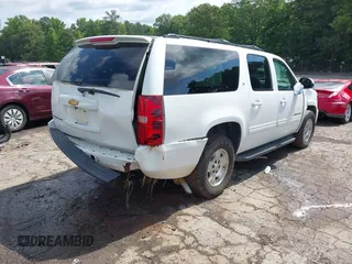2014 Chevrolet Suburban LT with VIN 1GNSCJE07ER211222, listed as a IAAI auction lot 42428084 with 214,712 mi miles and . Bid and sale history available at DreamBid. Image 4.