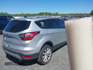 2018 Ford Escape Titanium with VIN 1FMCU9J96JUA33500, listed as a IAAI auction lot 42121736 with 105,430 mi miles and . Bid and sale history available at DreamBid. Image 4.