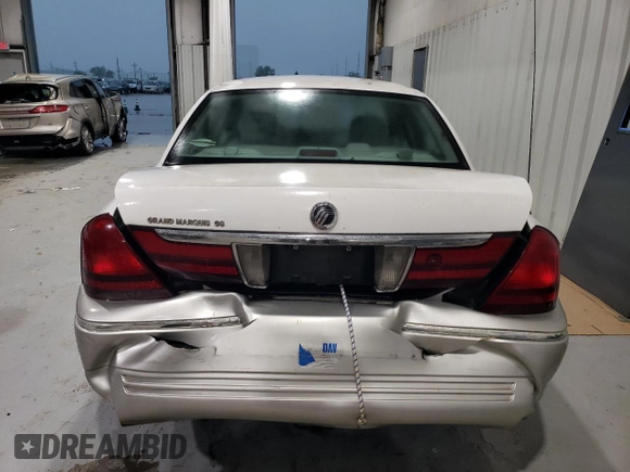 2005 Mercury Grand Marquis GS z VIN 2MEFM74W05X612471, wystawiony jako Copart lot #49455195 z przebiegiem 140 916 mil mil oraz Szkoda całkowita • Salvage title. Historia ofert i sprzedaży dostępna na DreamBid. Obrazek 6.