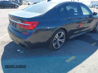 2016 BMW 7 Series 740i with VIN WBA7E2C52GG548048, listed as a IAAI auction lot 41701806 with 72,680 mi miles. Bid and sale history available at carsss.com. Image 4.