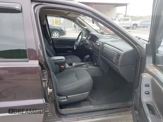 2004 Jeep Grand Cherokee Laredo z VIN 1J4GW48S94C209326, wystawiony jako IAAI lot #42309565 z przebiegiem 159 429 mil mil oraz . Historia ofert i sprzedaży dostępna na DreamBid. Obrazek 5.