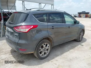 2015 Ford Escape Titanium z VIN 1FMCU0JX3FUA71770, wystawiony jako IAAI lot #42085635 z przebiegiem 141 890 mil mil oraz . Historia ofert i sprzedaży dostępna na DreamBid. Obrazek 4.