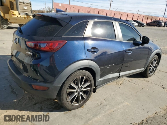 2017 Mazda CX-3 Touring z VIN JM1DKDC74H0165654, wystawiony jako Copart lot #41928295 z przebiegiem 173 567 mil mil oraz Szkoda całkowita • Salvage title. Historia ofert i sprzedaży dostępna na DreamBid. Obrazek 3.