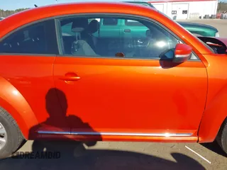 2019 Volkswagen Beetle S with VIN 3VWFD7AT7KM719940, listed as a IAAI auction lot 41190839 with 77,627 mi miles. Bid and sale history available at carsss.com. Image 14.