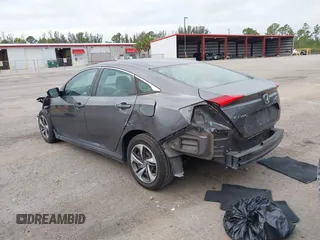 2019 Honda Civic Sedan LX with VIN 19XFC2F66KE024399, listed as a IAAI auction lot 42023498 with 50,173 mi miles. Bid and sale history available at carsss.com. Image 3.