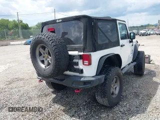 2012 Jeep Wrangler Sport z VIN 1C4AJWAG5CL171961, wystawiony jako IAAI lot #42590232 z przebiegiem 126 372 mil mil oraz . Historia ofert i sprzedaży dostępna na DreamBid. Obrazek 4.