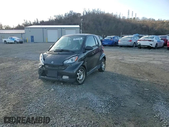 2012 Smart fortwo Pure z VIN WMEEJ3BA3CK570191, wystawiony jako Copart lot #43576165 z przebiegiem 80 511 mil mil oraz Szkody całkowita. Historia ofert i sprzedaży dostępna na DreamBid. Obrazek 13.