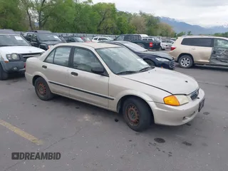 2000 Mazda Protege DX with VIN JM1BJ2227Y0237323, listed as a IAAI auction lot 42179683 with Not Provided miles and . Bid and sale history available at DreamBid. Image 1.