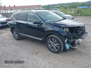 2021 Honda CR-V Touring with VIN 5J6RW2H92ML003064, listed as a IAAI auction lot 42298361 with 70,988 mi miles and . Bid and sale history available at DreamBid. Image 1.