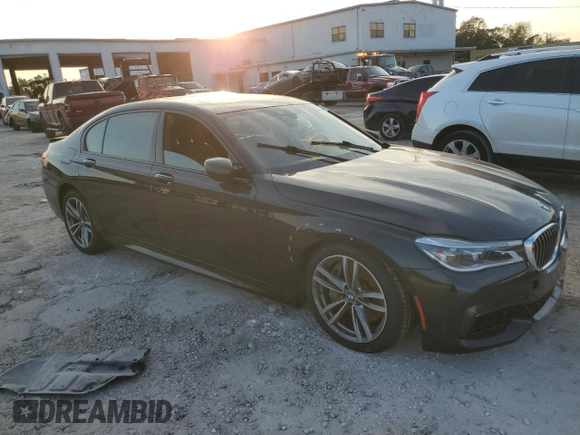 2018 BMW 7 Series 750i with VIN WBA7F0C5XJGM22674, listed as a Copart auction lot 74833524 with 0 mi miles and Salvage Title. Bid and sale history available at carsss.com. Image 4.