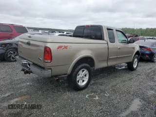 2002 Ford F-150 XL with VIN 1FTRX18L02NA58574, listed as a Copart auction lot 57156255 with 291,950 mi miles and Salvage title. Bid and sale history available at DreamBid. Image 3.