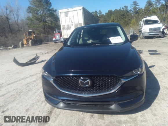 2020 Mazda CX-5 Touring with VIN JM3KFACM1L1817303, listed as a IAAI auction lot 41627859 with 57,268 mi miles. Bid and sale history available at carsss.com. Image 12.