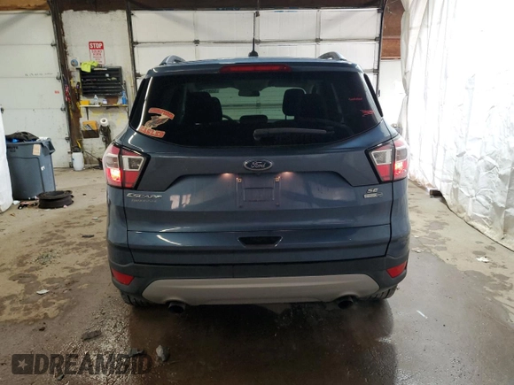 2018 Ford Escape SE z VIN 1FMCU9GD6JUC30324, wystawiony jako Copart lot #55833765 z przebiegiem 48 016 mil mil oraz Szkoda całkowita • Salvage title. Historia ofert i sprzedaży dostępna na DreamBid. Obrazek 6.