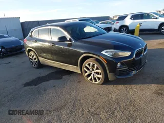 2018 BMW X2 sDrive28i z VIN WBXYJ3C39JEJ82506, wystawiony jako IAAI lot #41147390 z przebiegiem 42 060 mil mil oraz . Historia ofert i sprzedaży dostępna na DreamBid. Obrazek 1.