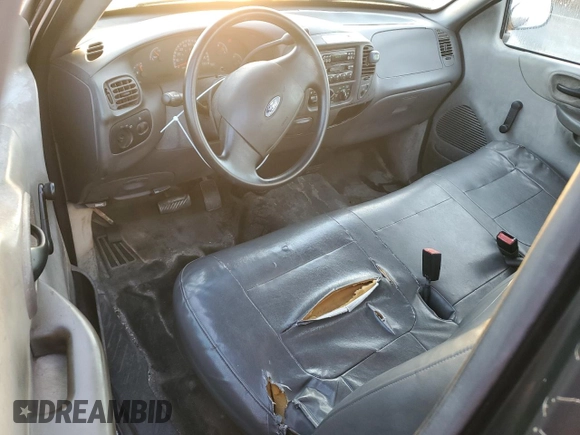 2003 Ford F-150 XL with VIN 1FTRF17W13NA97772, listed as a Copart auction lot 77692074 with Not Provided miles and Salvage Title. Bid and sale history available at DreamBid. Image 8.
