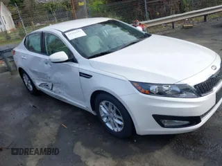 2013 Kia Optima LX with VIN KNAGM4A70D5336517, listed as a IAAI auction lot 41910443 with 76,979 mi miles. Bid and sale history available at carsss.com. Image 1.