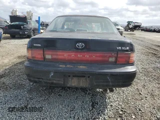 1994 Toyota Camry XLE with VIN JT2GK13E0R0012242, listed as a Copart auction lot 50966775 with 70,922 mi miles and Salvage Title. Bid and sale history available at carsss.com. Image 6.