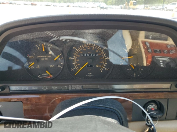 1991 Mercedes-Benz 560 with VIN WDBCA39E9MA599487, listed as a Copart auction lot 51921915 with 59,132 mi miles and Salvage Title. Bid and sale history available at DreamBid. Image 9.