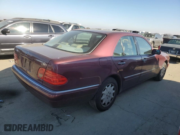 1998 Mercedes-Benz E 320 with VIN WDBJF25FXWA549962, listed as a Copart auction lot 87876005 with 303,884 mi miles and Salvage Title. Bid and sale history available at DreamBid. Image 3.