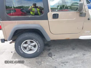 2005 Jeep Wrangler Sport with VIN 1J4FA49SX5P317120, listed as a IAAI auction lot 42677397 with 71,403 mi miles and . Bid and sale history available at DreamBid. Image 19.