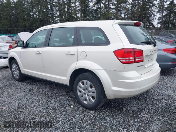 2015 Dodge Journey SE z VIN 3C4PDCAB6FT736330, wystawiony jako IAAI lot #41837047 z przebiegiem 123 567 mil mil oraz . Historia ofert i sprzedaży dostępna na DreamBid. Obrazek 3.