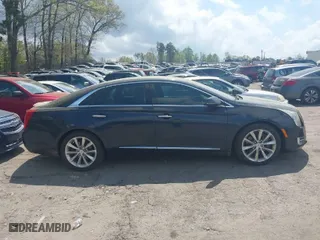 2013 Cadillac XTS Luxury with VIN 2G61P5S36D9214588, listed as a IAAI auction lot 41953947 with 142,204 mi miles. Bid and sale history available at carsss.com. Image 13.