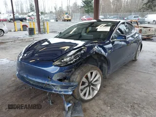 2018 Tesla Model 3 Long Range Battery z VIN 5YJ3E1EA7JF035949, wystawiony jako IAAI lot #41627027 z przebiegiem Nie podano mil oraz . Historia ofert i sprzedaży dostępna na DreamBid. Obrazek 17.