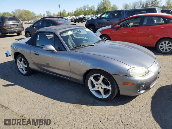 2003 Mazda MX-5 Miata Cloth with VIN JM1NB353430308653, listed as a Copart auction lot 53129865 with 144,549 mi miles and Salvage Title. Bid and sale history available at DreamBid. Image 4.