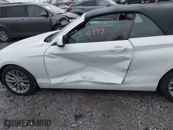 2016 BMW 2 Series 228i xDrive with VIN WBA1L9C59GV767802, listed as a IAAI auction lot 41132997 with 87,674 mi miles. Bid and sale history available at carsss.com. Image 6.