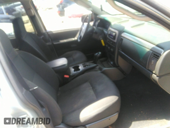 2004 Jeep Grand Cherokee Laredo z VIN 1J4GW48SX4C309998, wystawiony jako IAAI lot #42307167 z przebiegiem 306 912 mil mil oraz . Historia ofert i sprzedaży dostępna na DreamBid. Obrazek 5.