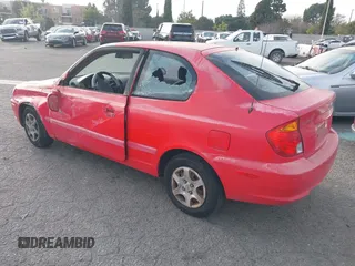2003 Hyundai Accent GL with VIN KMHCG35C23U238969, listed as a IAAI auction lot 41462884 with 156,682 mi miles. Bid and sale history available at carsss.com. Image 3.