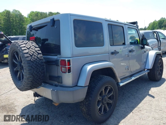 2013 Jeep Wrangler Unlimited Sahara with VIN 1C4BJWEG4DL666930, listed as a IAAI auction lot 42310569 with 206,577 mi miles and . Bid and sale history available at DreamBid. Image 4.