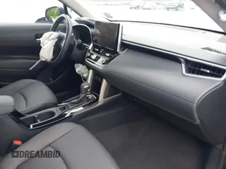 2023 Toyota Corolla Cross XLE with VIN 7MUEAAAG7PV065106, listed as a IAAI auction lot 42168195 with 6,519 mi miles and . Bid and sale history available at DreamBid. Image 5.