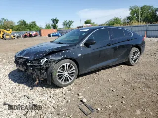 2018 Buick Regal Essence with VIN W04GP6SX5J1056447, listed as a Copart auction lot 57402445 with 110,930 mi miles and Salvage title. Bid and sale history available at DreamBid. Image 1.