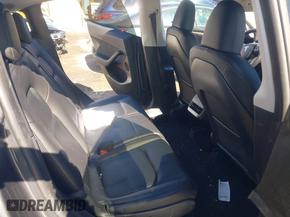 2023 Tesla Model Y Long Range with VIN 7SAYGAEE9PF905943, listed as a IAAI auction lot 41444255 with 11,179 mi miles and . Bid and sale history available at DreamBid. Image 8.