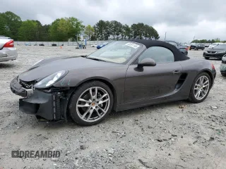 2015 Porsche Boxster with VIN WP0CA2A88FS120121, listed as a Copart auction lot 50591195 with 71,836 mi miles and Salvage title. Bid and sale history available at DreamBid. Image 1.
