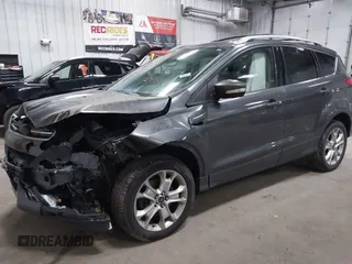 2016 Ford Escape Titanium with VIN 1FMCU9J90GUB35593, listed as a IAAI auction lot 42309020 with 173,019 mi miles and . Bid and sale history available at DreamBid. Image 2.