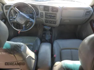 2000 Oldsmobile Bravada z VIN 1GHDT13WXY2255649, wystawiony jako Copart lot #80021214 z przebiegiem Nie podano mil oraz Szkody całkowita. Historia ofert i sprzedaży dostępna na DreamBid. Obrazek 8.